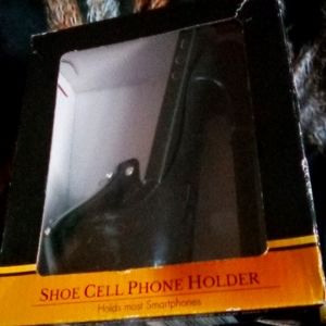 Shoe collection phone holder w a hole for cord.